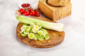 Ripe sliced leek over board
