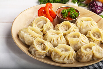 Steamed Nepali dumpling Momo with sauce