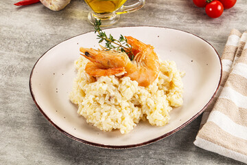 Italian risotto with prawn served thyme