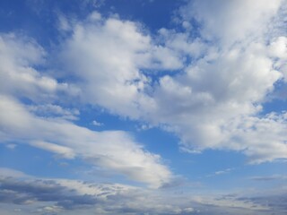 Beauty cloud against a blue sky background. Sky slouds. Blue sky with cloudy weather, nature cloud. White clouds, blue sky and sun.