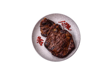 Delicious juicy beef ribeye steak grilled with salt, spices and herbs