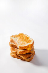 Stack toasted bread slices on white background, breakfast food