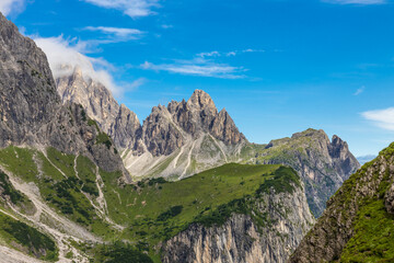 Dolomites beautiful mountain landscape on a sunny day. Hiking in the Alps in Italy, South Tirol mountain range of Alpi Dolomiti di Sesto near Cortina di Amprezzo and Tre Cime di Lavaredo alpine scene