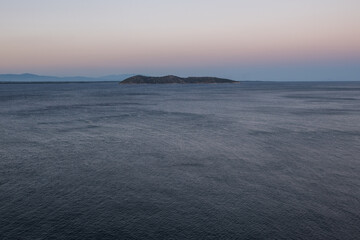 Fototapeta premium A small lonely island in the middle of the sea