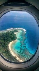 Fototapeta premium Tropical island aerial view through airplane window