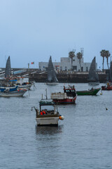 Cascais beach near Lisbon in Portugal. Cloudy day, empty beach, some fishermen's boats
