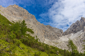 Dolomites beautiful mountain landscape on a sunny day. Hiking in the Alps in Italy, South Tirol mountain range of Alpi Dolomiti di Sesto near Cortina di Amprezzo and Tre Cime di Lavaredo alpine scene