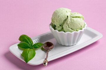 Homemade ice cream (sundae) with basil.