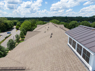 Drone Images of An Asphalt Shingle Roof on an Apartment Building on a Bright Sunny Day