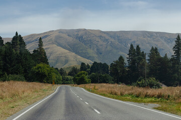 Long road leading to distant mountains