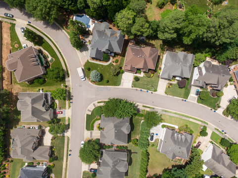 Professional Top Down Aerial Drone Image of a Suburban Neighborhood and Residential Street in Raleigh North Carolina on a Sunny Day: Architecture, Real Estate, Transportation