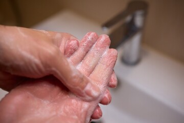 An automatic hand soap dispenser creates foam, promoting hygiene and cleanliness