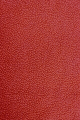 Fototapeta premium Vertical close-up photo of red fabric.