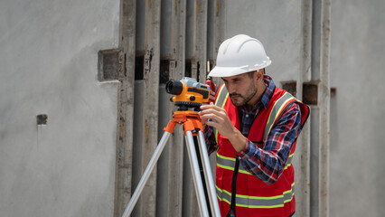 Civil or construction engineer using a survey camera, or an engineer with an auto level camera.