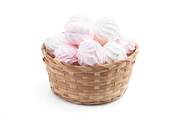 Marshmallows in wicker basket isolated on white