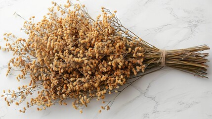   A vase of dried flowers sits atop a white countertop, surrounded by a heap of similarly arranged blooms