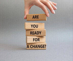 Change symbol. Wooden blocks with words Are you ready for a new change. Businessman hand. Beautiful grey background. Business and change concept. Copy space.