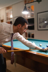 man playing pool, pool balls on the table