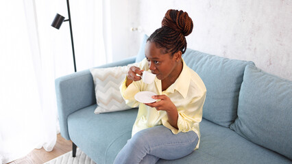 Happy woman enjoying her morning coffee