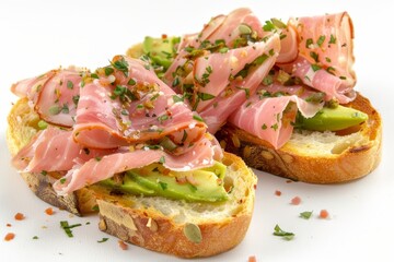 Turkey ham bruschetta on avocado slices on white surface for elegant presentation