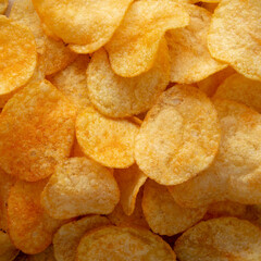 Cheese Potato Chips, top view. Flat lay, overhead, from above. Close-up.