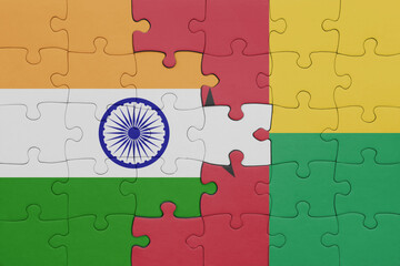 puzzle with the colourful national flag of guinea bissau and flag of india.