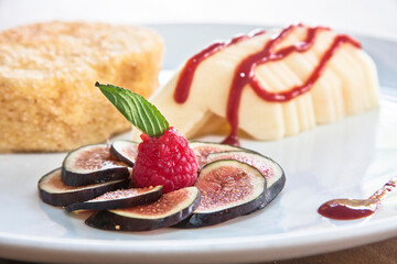 dessert of torrijas or French toast accompanied by fig, apple and raspberry fruit, fried milk dessert