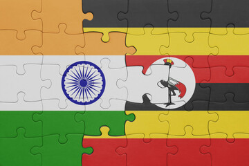 puzzle with the colourful national flag of uganda and flag of india.