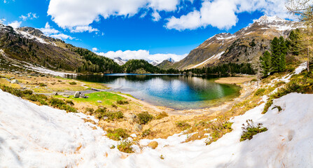 A view of the Cavlocc lake, in Engadine, Switzerland, and the mountains that surround it.
