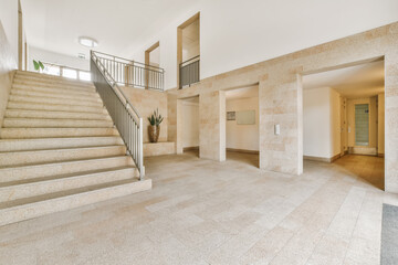 Spacious modern lobby interior with staircase in Amsterdam