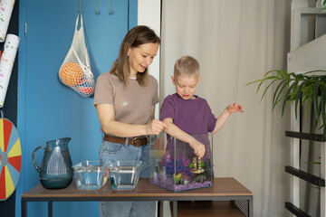 Family bonding over fish tank maintenance