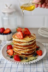 pancakes with strawberry and honey