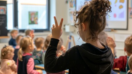 A girl in a classroom is holding up a peace sign - Powered by Adobe