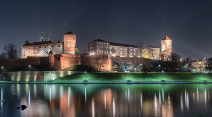 Majestic wawel castle by night with reflection
