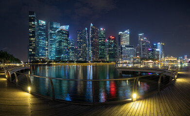 Panoramic night view of modern city skyline from waterfront