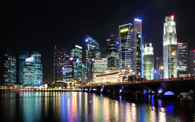 Vibrant nighttime cityscape with illuminated skyscrapers