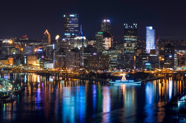 Dazzling cityscape at night with reflective waterfront
