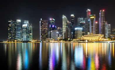 Illuminated skyline reflections at night