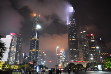 City night lights: illuminated skyscrapers and urban street