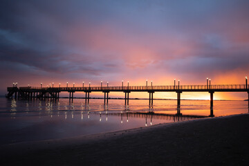 Sunset glow at pier beach