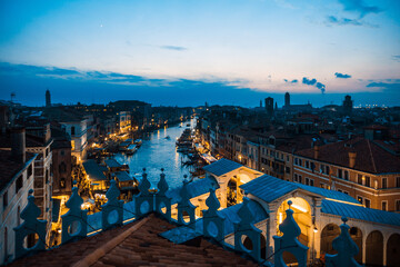 Serene twilight view of venice with illuminated canals and historic architecture