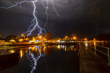 Electric night: lightning storm over waterfront