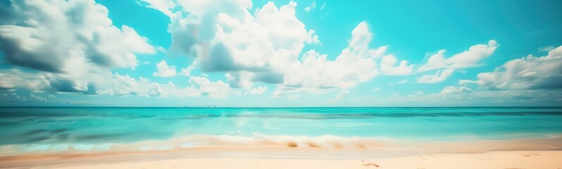 Obraz premium Abstract blur defocused background. Tropical summer beach with golden sand, turquoise ocean and blue sky with white clouds on bright sunny day