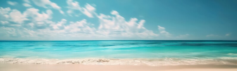 Fototapeta premium Abstract blur defocused background. Tropical summer beach with golden sand, turquoise ocean and blue sky with white clouds on bright sunny day