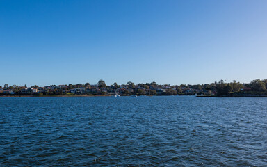 Houses skyline along Parramatta River coastline, Sydney, Australia.