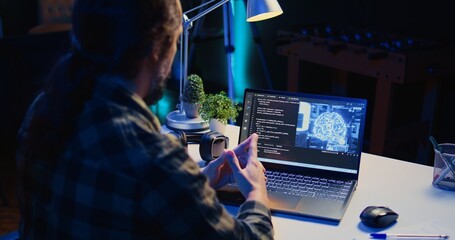 Computer scientist updating artificial intelligence machine learning algorithm, writing binary code...