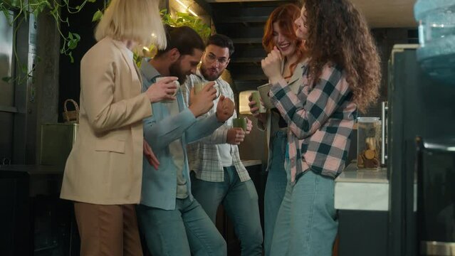 Diverse men women freelancers coworkers dancers friends happy joyful girls guys male female dance music business team office colleagues dancing in bar coworking celebrate corporate party coffee break