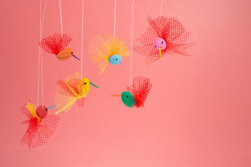 Obraz premium a fun DIY project, crafting peanut hummingbird toys. This simple homemade activity not only entertains but also teaches recycling concepts,