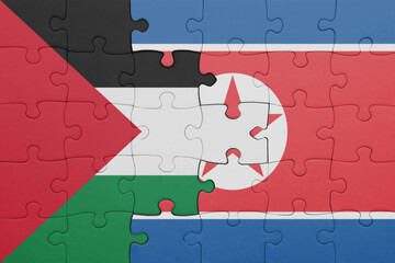 puzzle with the colourful national flag of north korea and flag of palestine.