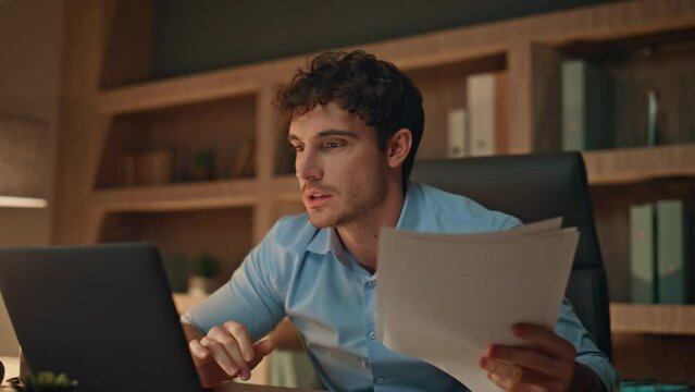 Manager worried financial collapse throwing papers at evening workplace close up